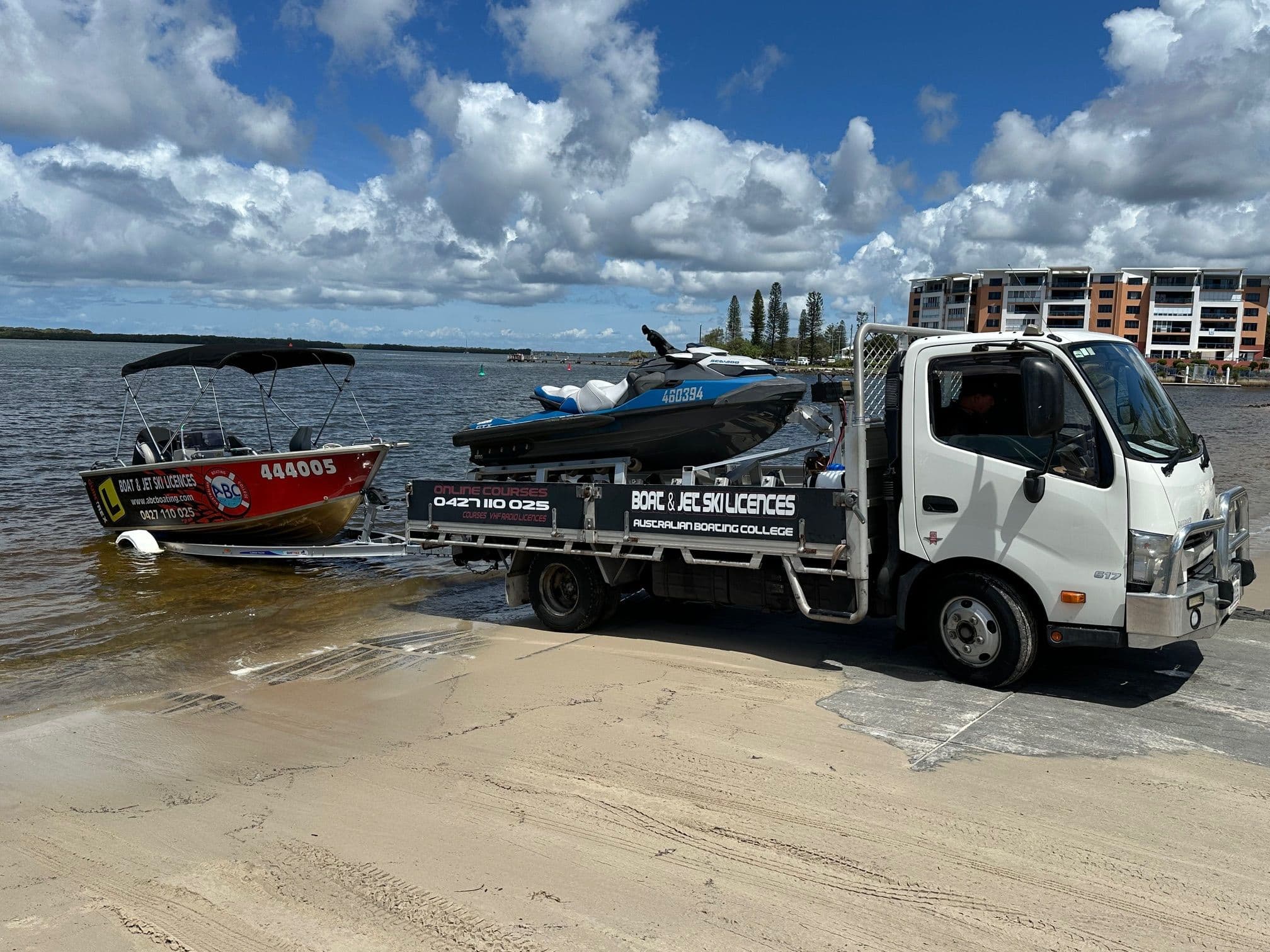 An ABC Boating training boat and Sea-Doo jet ski launched together at a Sunshine Coast boat ramp